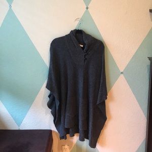 a dark gray tunic.